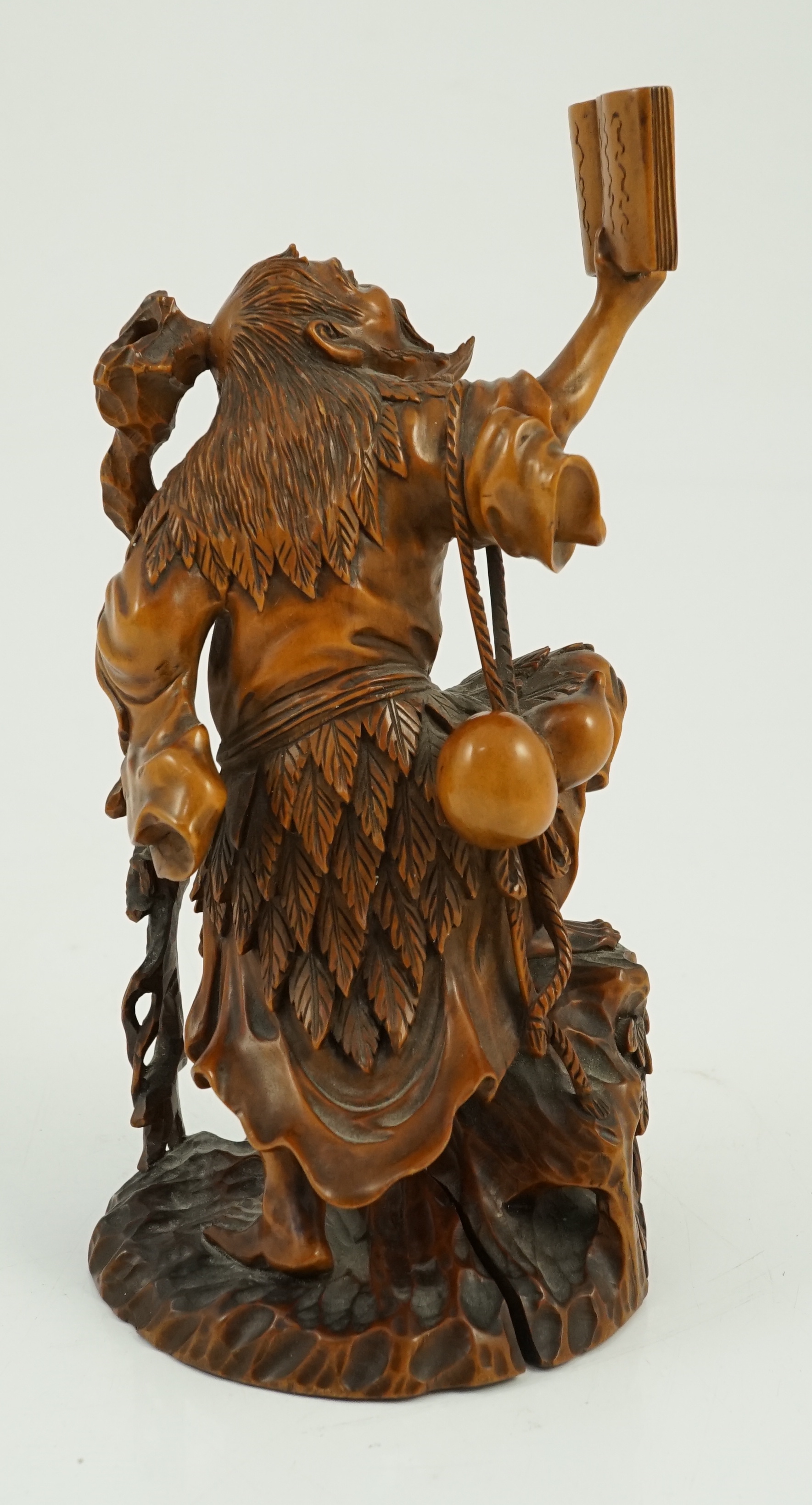 A Japanese boxwood okimono of Gama Sennin and two toads, 19th century, age crack to base